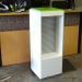 White and Green Retail Display Stand with Recessed Slatwall